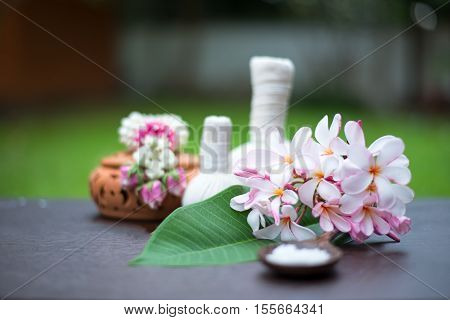 Spa massage compress balls herbal ball on the wooden with treaments spa Thailand select focus