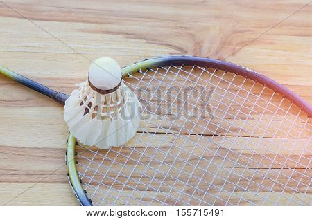 badminton ball shuttlecock with racket on court floor black and white tone