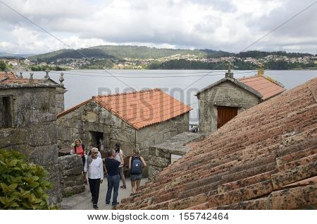 COMBARRO, SPAIN - AUGUST 4, 2016: People in the streets of Combarro a village of the province of Pontevedra in the Galicia region of Spain.