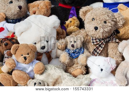 assortment of old teddies at flea market