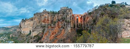Panorama of Puente Nuevo, New Bridge, at night illuminated over the Tajo Gorge in Ronda, Andalusia, Spain