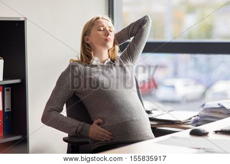 pregnancy, business, gestosis and people concept - tired pregnant businesswoman feeling sick at office work