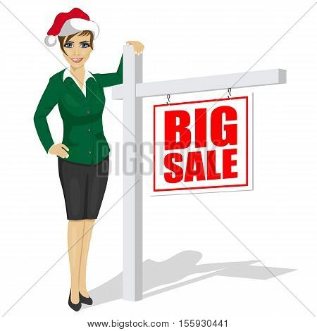 woman wearing santa hat standind next to big sale sign over white background