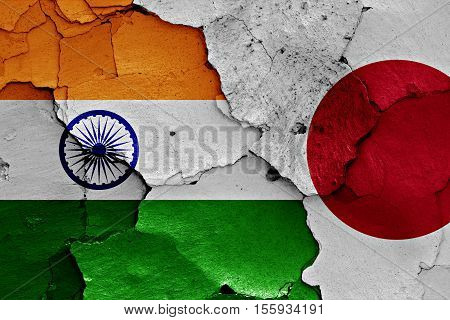 flags of India and Japan painted on cracked wall
