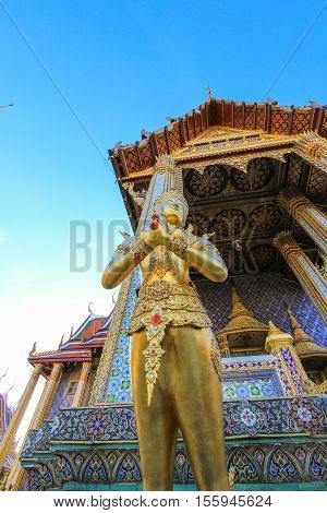 Golden statue in side public royal temple, Bangkok, Thailand