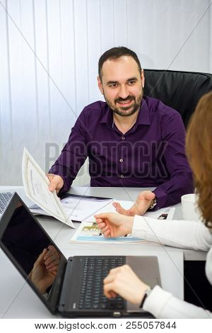 Man Is Presenting A New Product To A Woman