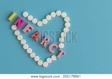 Concept Infarction. An Infarction That Destroys The Heart On A Blue Background. Copy Space