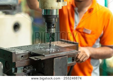Drilling Machine, Employee Drilling Machine In Flat Steel Plate With Bench Drill.