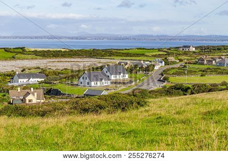 Farms And Houses In The Fanore Village With Galway Bay In Background