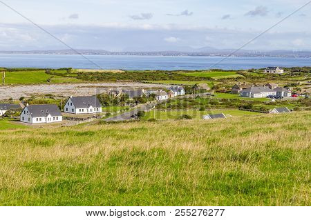 Farms And Houses In The Fanore Village With Galway Bay In Background