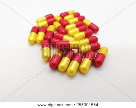 Medication And Healthcare Concept. Many Green-blue Capsules Of Amoxicillin 500 Mg. Isolated On White
