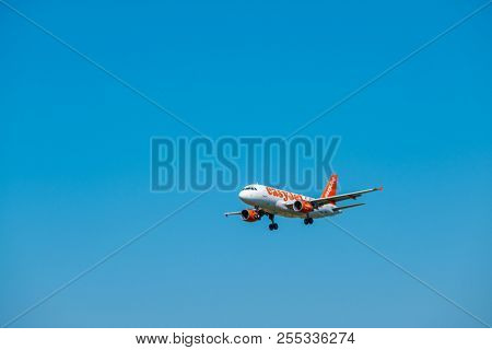 Zurich, Switzerland - July 19, 2018: EasyJet Airline Company airplane preparing for landing. EasyJet Airline Company Limited is a British low-cost carrier airline headquartered at London Luton Airport