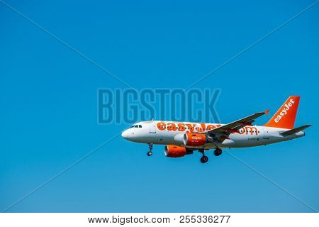 Zurich, Switzerland - July 19, 2018: EasyJet Airline Company airplane preparing for landing. EasyJet Airline Company Limited is a British low-cost carrier airline headquartered at London Luton Airport