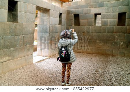 Female Tourist Taking Pictures Inside Coricancha, The Temple Of The Sun Of The Incas In Cusco, Peru,