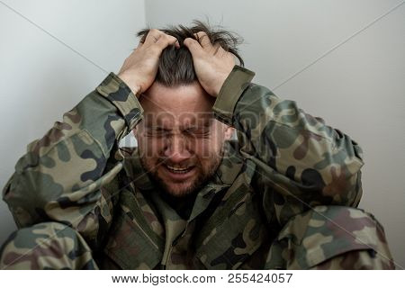 Crying Professional Soldier With Depression And Trauma After War