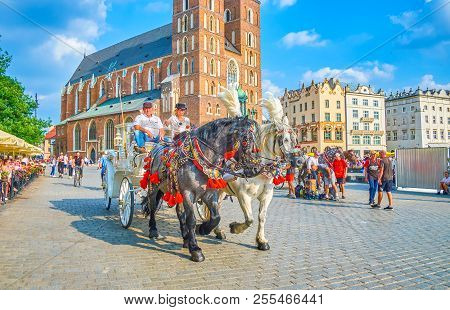 Krakow, Poland - June 11, 2018: Riding On Horse-drawn Carriage Is The Easiest And The Most Exciting 