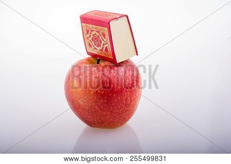 Red Apple And  Islamic Holy Book Quran In Mini Size