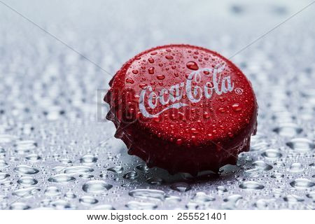 Kiev, Ukraine - January 12, 2017: Classic Cap Close-up Of Coca-cola On A Gray Background With Drops 