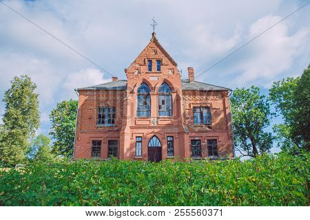 Old Manor House And Meadow, Green Trees. Travel Photo 2018.