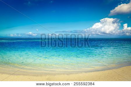 Sandy tropical Wolmar beach at sunny day. Beautiful landscape. Panorama. Mauritius