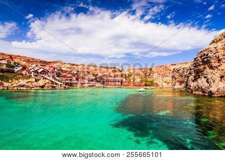 Malta, Il-mellieha. View Of The Famous Village Popeye And Bay On A Sunny Day. Malta.