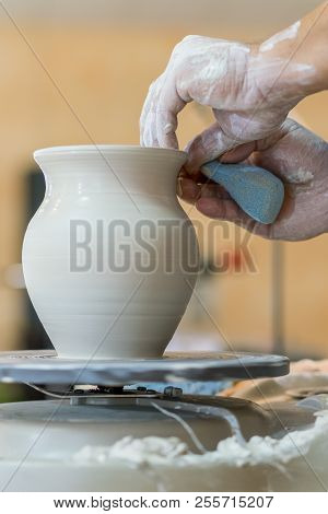 Creating A Jar Or Vase Of White Clay Close-up. Master Crock. Man Hands Making Clay Jug Macro. The Sc