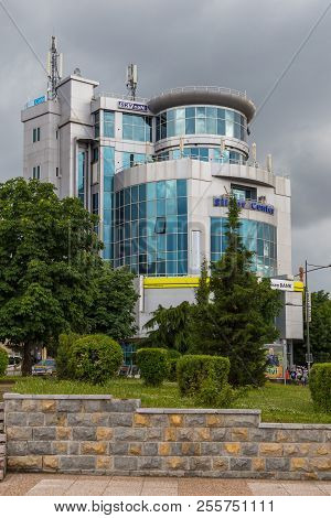 Korce, Albania- 27 June 2014: Street Perspective Korce Glass Building. Facade Of Modern Building.sky