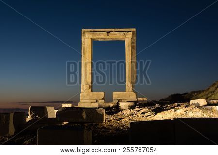 The Remains Of The Ancient Temple Of Delian Apollo, Also Called Portara, At Dusk, At Naxos Island, G