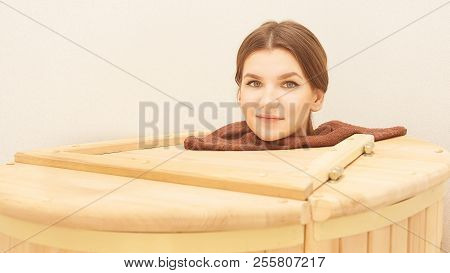Healing Spa Treatment. Cedar Barrel. Young Beautiful Girl. Health Accessories. Salon Procedure