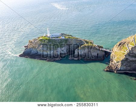 Aerial View Of The Beautiful Cliffs Close To The Historic South Stack Lighthouse On Anglesey - Wales