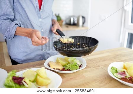 Female Hands, Black Frying Pan, Boiled Potatoes, Green Salad, Meat Cutlet With Cheese, White Ceramic