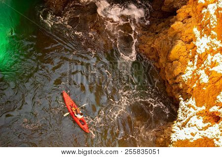 Aerial View On A Kayak In The  Lagoon Between Mountains. Kayaking Journey In Deep Blue Water And Yel