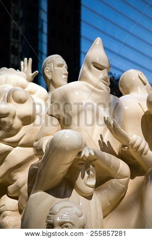 Montreal, Canada - 14th Sept2017: The Illuminated Crowd by Raymond Mason, stands outside the McGill University. It shows a group of people looking foward whilst behind them everything slips into chaos