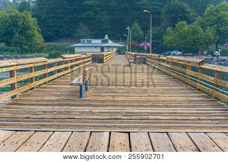 Smoke From Fires Creates A Haze Over A Pier And The Shoreline In Ruston, Washington.