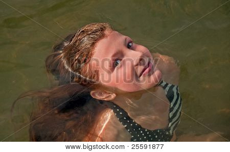 Cute 10 Year Old Girl Swimming Face Only Out Of Water