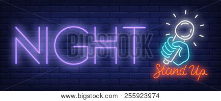 Standup Night Neon Sign. Hand Holding Mike And Lettering On Brick Background. Night Bright Advertise