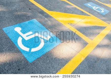 Image Of The Signs Of Places For People With Disabilities In The Parking Lot For Cars. Handicapped S