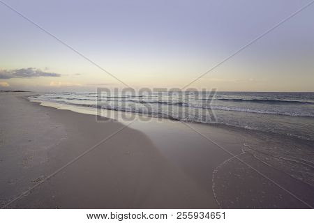 Wide Angle Seascape At Dawn At Pensacola, Florida Beach. Pink, Mave And Soft Grays And Blues.