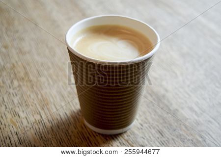 Cappuccino Coffee Cup On Wooden Table