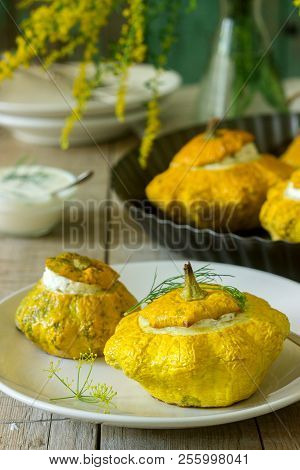 Pattypan Squash Or Pumpkins Stuffed With Ricotta With Basil And Dill And Served With Sour Cream Sauc