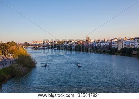 Guadalquivir River. Panoramic View Of The Waterfront Of The Guadalquivir River In Seville, Andalusia