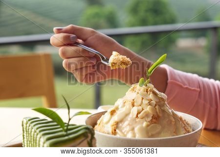 Girl With Tasty Bingsoo, Korean Style Healthy Ice Cream On The Table Wood.
