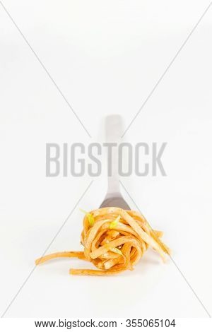 Classic Spaghetti Carbonara With Cream And Tomato Sauce On Fork. Shallow Depth Of Field. Spaghetti O