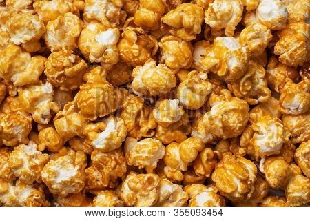 Background Texture Of Popcorn In Caramel Glaze. Close Up.