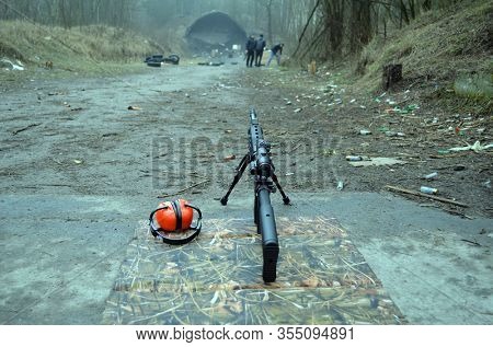 Modern AR15 rifle with a sight aim. Unformal shooting range near Kiev. Former Soviet military base.March 4, 2020. Kiev Region, Ukraine