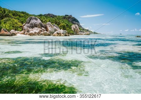 La Digue Island, Seychelles. World Famous Paradise Beach Anse Source Dargent With Shallow Blue Lagoo