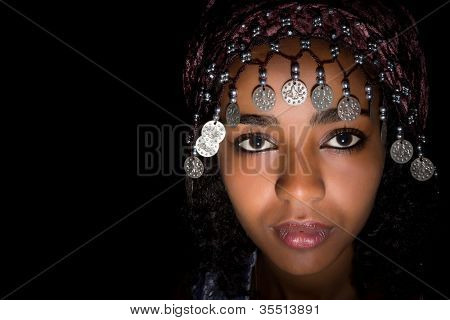 African attractive young woman with traditional moroccan headdress