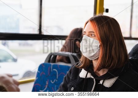 Woman Commutes In A Protective Face Mask. Coronavirus, Covid-19 Spread Prevention Concept, Responsib