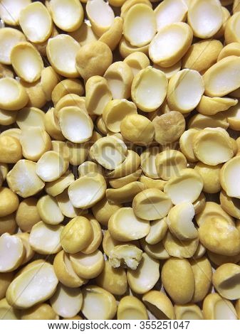 Yellow Split Dried Peas Background. Vertical. Close Up.