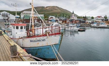 Husavik, Iceland - August 2019: Traditional Old Wooden Fisherman Boats Used For Whale Watching In Hu